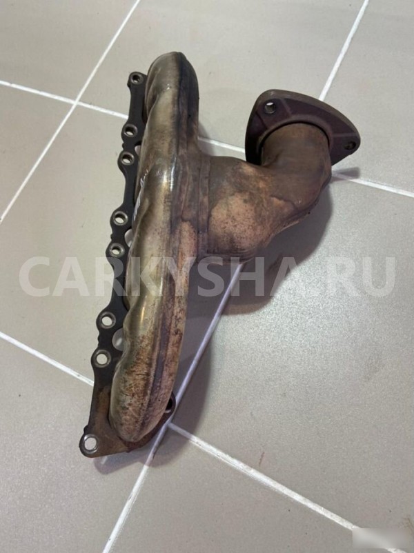 Коллектор выпускной левый Porsche Cayenne 1 Porsche Cayenne оригинальный номер 1049721114