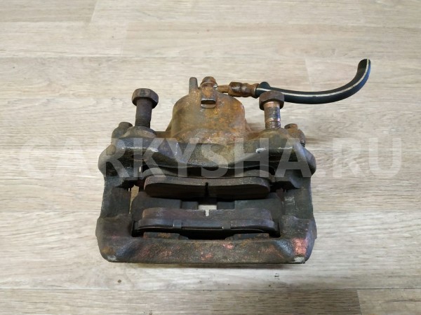 Суппорт тормозной передний правый Nissan Primera оригинальный номер 410012F021